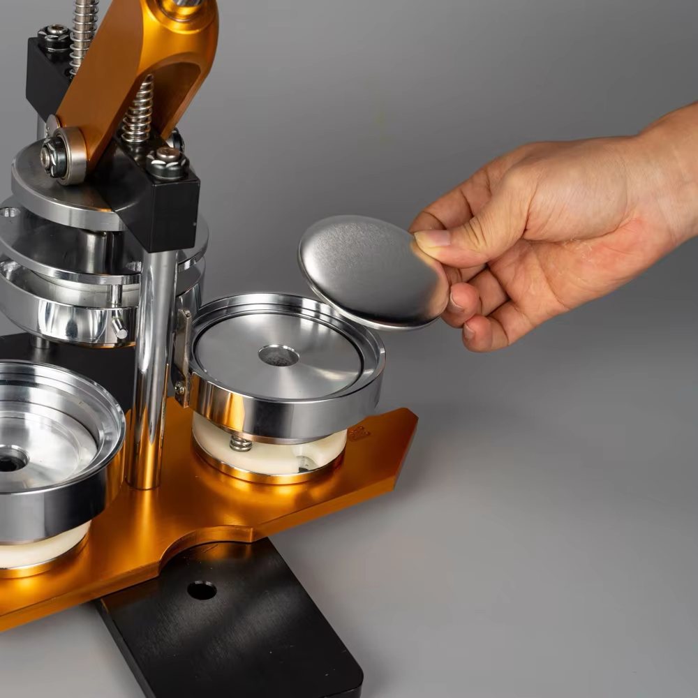 A hand placing a shell into a magnet press die